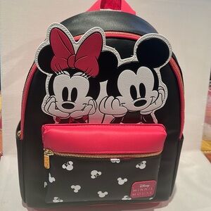 NWT Disney Minnie Mouse Backpack with three outside pockets and two way zipper.